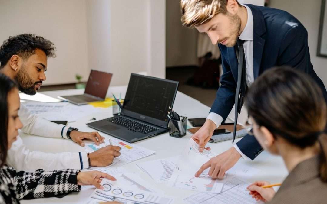 Manufacturing executives looking at financial papers